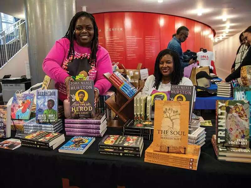 Women at Zora summit sell books